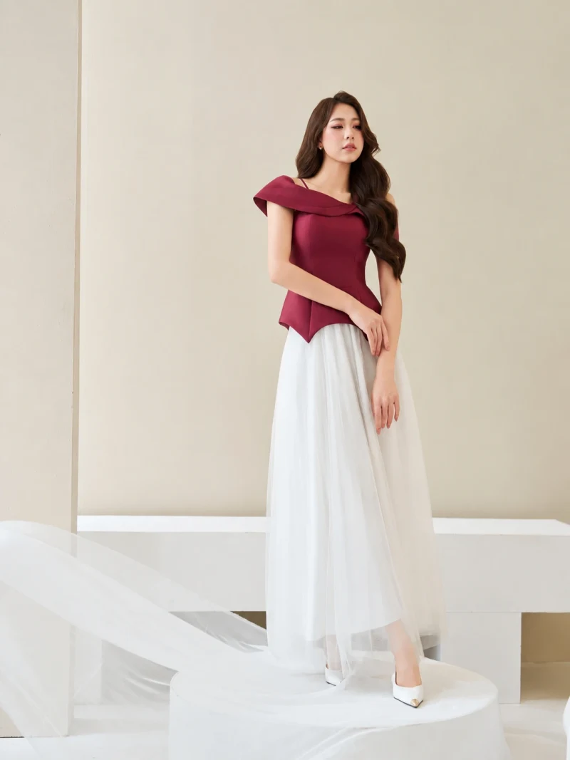 Stylized off the shoulder peplum shirt